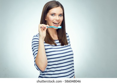 Smiling Girl With Brace Brushing Teeth. Teenager Toothy Problem. Isolated Portrait.