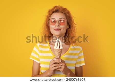 smiling girl with cone icecream in studio. girl with cone icecream on background.