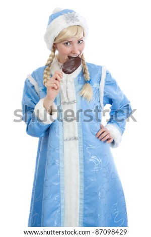 smiling girl dressed in traditional russian christmas costume of Snegurochka (Snow Maiden) eating ice cream, isolated on white background