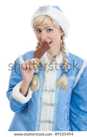 smiling girl dressed in traditional russian christmas costume of Snegurochka (Snow Maiden) eating ice cream, isolated on white background