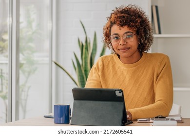 smiling girl with laptop working at home