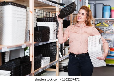 Smiling Girl Looking For Functional Baskets For Home Storage In Store