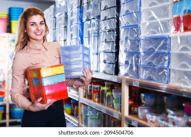 Smiling Girl Looking For Functional Boxes For Home Storage In Store