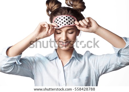 Smiling girl in mask sleeping with eyes closed
