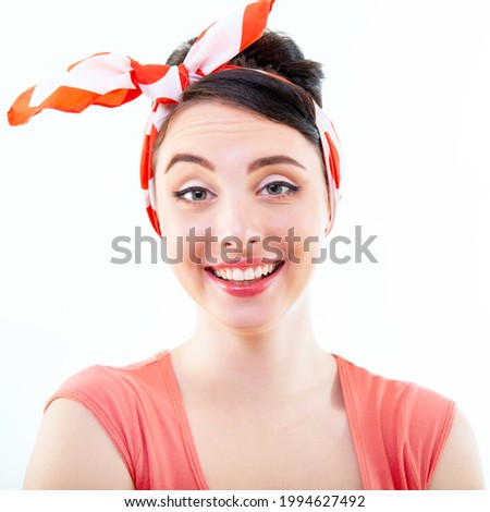 Smiling girl, retro portrait of young cheerful woman in pin-up style, vintage stylization, studio shot over white background. 