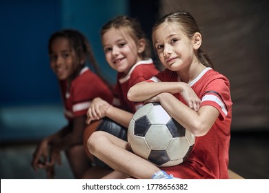 Smiling Girl With Soccer Ball  In Good Mood  Before Training  In Changing Room.