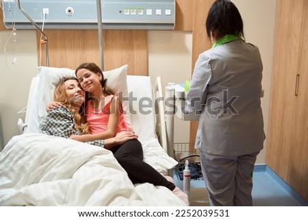 Similar – Doctor giving a prescription to senior patient