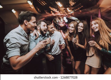 Smiling Girl. Vocal Battle. Cheerful. Singing Songs. Beautiful Girls. Friends at Karaoke Club. Karaoke Club. Celebration. Young People. Party Maker. Girls Sing. Smile. Trendy Nightclub. Have Fun. - Shutterstock ID 1268877028