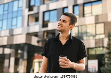 Smiling girl in a white T-shirt and jeans is standing outside, looking at the camera and smiling. Street portrait of stylish positive girl in casual clothes on a walk - Shutterstock ID 1519754096
