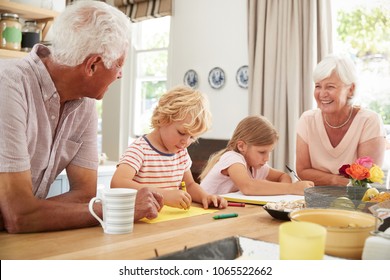 Smiling Grandparents With Grandkids In The Kitchen, Close Up