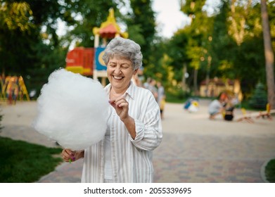 Smiling Granny Holds Cotton Candy, Amusement Park