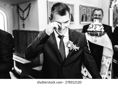 Smiling Groom In Suit Crying In Church