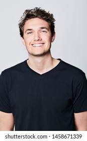 Smiling guy in black t-shirt, portrait