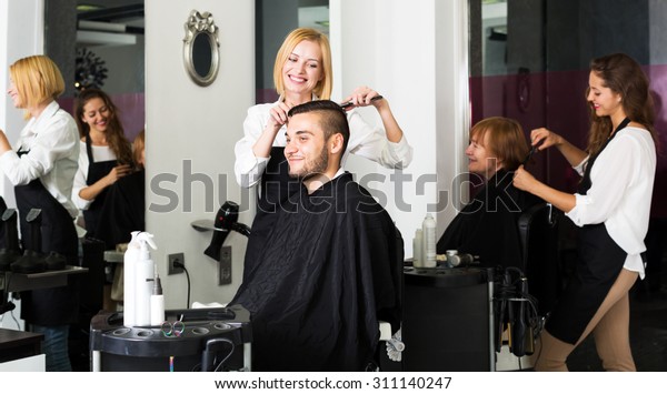 Smiling Guy Cuts Hair Hair Salon Stock Photo Edit Now 311140247