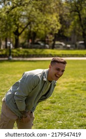 Smiling Guy Enjoying In The Park On Beautiful Summer Time.Friendship Concept