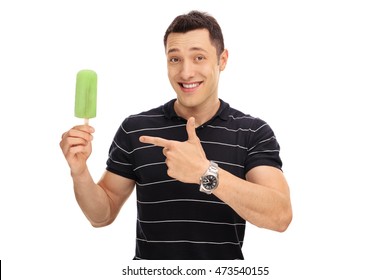 Smiling Guy Holding An Ice Cream And Pointing At It Isolated On White Background