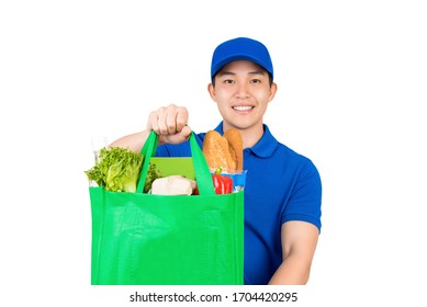 Smiling Handsome Asian Delivery Man Holding Grocery Shopping Bag Giving To Customer Isolated On White Background