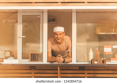 Smiling Handsome Chef Looking At Camera From Food Truck