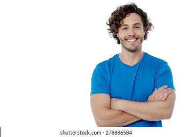 Smiling handsome man posing with folded arms