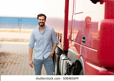 Smiling Handsome Masculine Driver Stranding Next To His Red Truck Outside