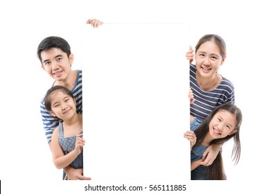 Smiling Happy Asian Family With Big White Poster On Isolated Background