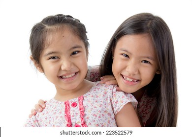 Two Little Asian Girls Sisters Hugging Stock Photo (Edit Now) 1286658124