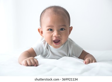 Smiling Happy Baby Tummy Time On Bed