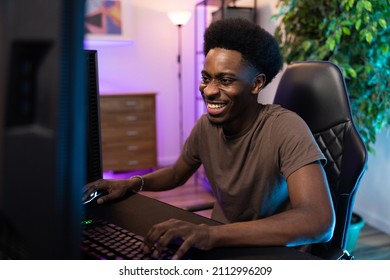 Smiling, Happy Boy Sits In A Room Lit Up With Led Colored Lights, Professional Gamer Plays Computer Games, Laughing Round, After School Entertainment, Virtual World