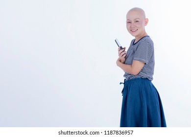 Smiling Happy Cancer Woman In Chemotherapy Period No Hair Working At Home With Technology, Laptop, Smartphone On Isolated Background