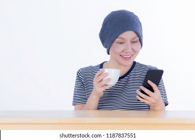 Smiling Happy Cancer Woman In Chemotherapy Period No Hair Working At Home With Technology, Laptop, Smartphone On Isolated Background