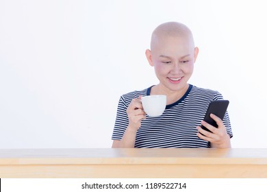 Smiling Happy Cancer Woman In Chemotherapy Period No Hair Working At Home With Technology, Laptop, Smartphone On Isolated Background