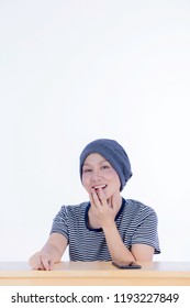 Smiling Happy Cancer Woman In Chemotherapy Period No Hair Working At Home With Technology, Laptop, Smartphone On Isolated Background