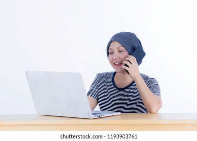 Smiling Happy Cancer Woman In Chemotherapy Period No Hair Working At Home With Technology, Laptop, Smartphone On Isolated Background