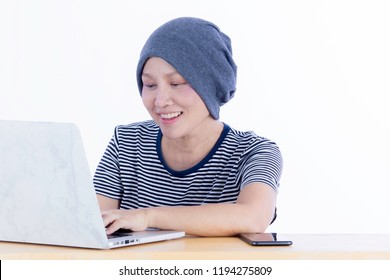 Smiling Happy Cancer Woman In Chemotherapy Period No Hair Working At Home With Technology, Laptop, Smartphone On Isolated Background