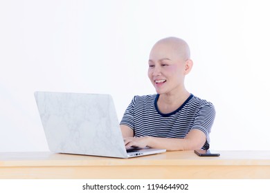 Smiling Happy Cancer Woman In Chemotherapy Period No Hair Working At Home With Technology, Laptop, Smartphone On Isolated Background