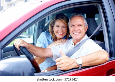 Smiling Happy Elderly Couple In The Car