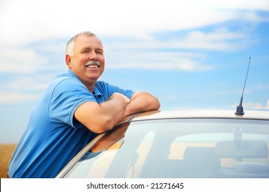 Smiling Happy Elderly Man  In The New Car