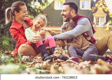 Smiling Happy Family Have Fun At Backyard. 