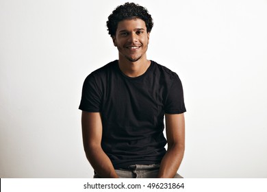 Smiling happy healthy African American model wearing a blank cotton short-sleeved t-shirt isolated on white