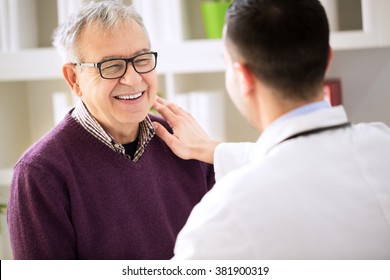 Smiling happy old patient visit doctor