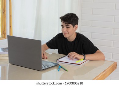 Smiling and happy student takes online classes at home - Powered by Shutterstock