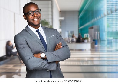 Smiling happy and successful CEO business man corporate executive in large downtown building