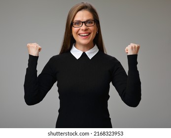 Smiling Happy Woman In Black Business Suit Wearing Glasses Flexing Her Arms To Show Strength, Isolated Female Power Concept Portrait.