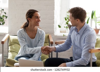 Smiling Happy Woman Shaking Hand Of Confident Businessman, Getting Acquaintance With New Business Partner, Making Deal, Greeting, Introducing To Client, Successful Negotiation, Agreement