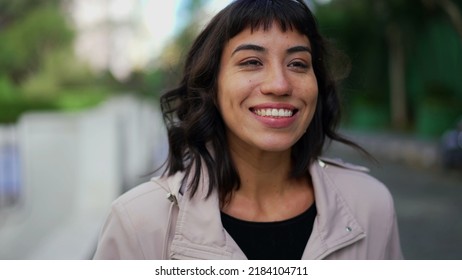 Smiling Happy Young Woman Walking Outside. Portrait Face Of One Hispanic Latina Girl Walks Smiling