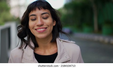 Smiling Happy Young Woman Walking Outside. Portrait Face Of One Hispanic Latina Girl Walks Smiling