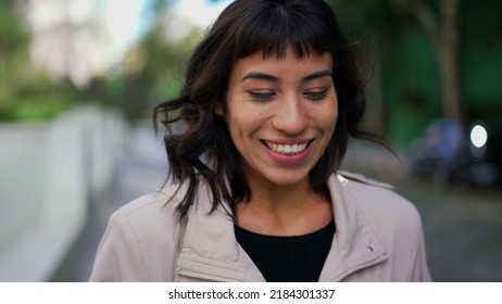 Smiling Happy Young Woman Walking Outside. Portrait Face Of One Hispanic Latina Girl Walks Smiling