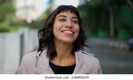 Smiling Happy Young Woman Walking Outside. Portrait Face Of One Hispanic Latina Girl Walks Smiling