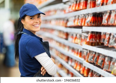 Smiling Hardware Store Worker Looking At The Camera