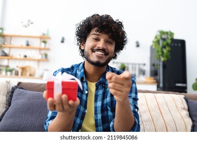 Smiling Headshot Of Smiling Indian Man Talking Online, Celebrates A Birthday, Gives A Gift To A Friend Or Loved One. Laughing At Camera, Making Video Call At Home